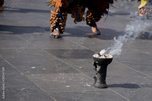 Copal y pies de danzante mexicano con huaraches típicos y ornamentos llamados huesos de fraile photo