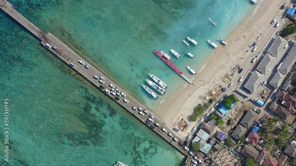 Pull Up Top Down Drone Shot of Cars Entering Nusa Penida Island via Toya Pakeh Harbour. Bali - Indonesia Pull Up Top Down Drone Shot of Cars Entering Nusa Penida Island via Toya Pakeh Harbour. Bali - Indonesia