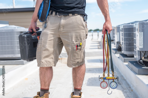 Photography Technician with Hvac tools on Roof