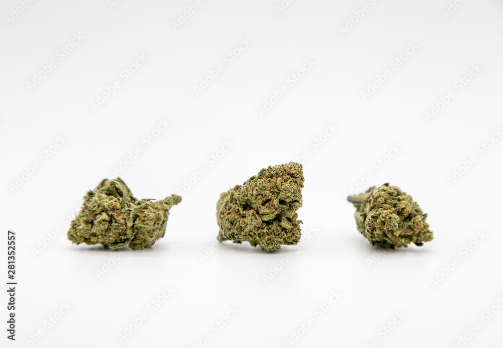 Multiple marijuana buds on white background Multiple marijuana buds on white background