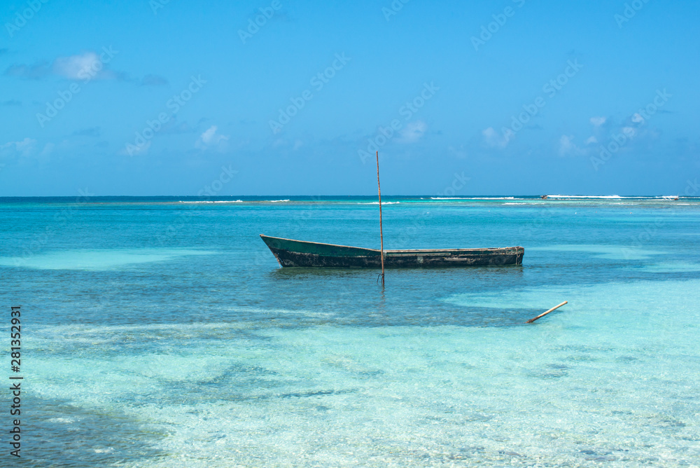 boat in the sea on one of san blas panama islands