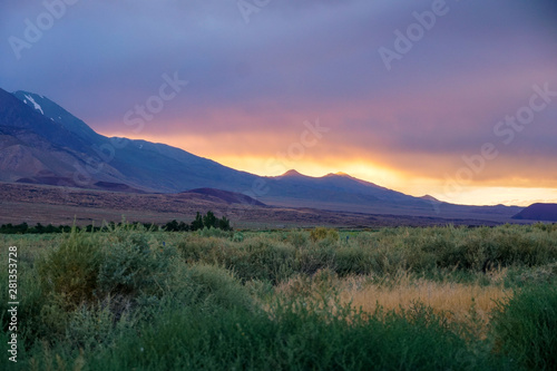 Mountain range colorful sunset with clouds before storm , Eastern Sierra Mountains, Mono County, California, USA