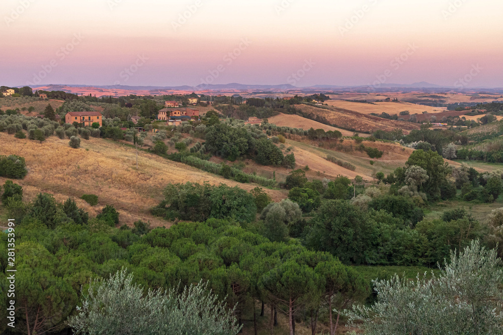 Naklejka premium Beautiful landscape of Tuscany, near Siena, at sunset hour with dusk