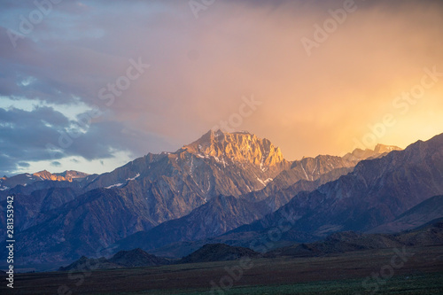Mountain range colorful sunset with clouds before storm , Eastern Sierra Mountains, Mono County, California, USA