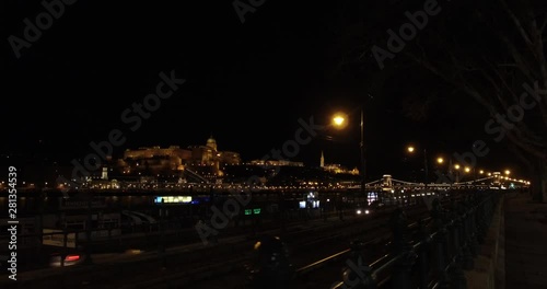View of the Buda Castle at night time from the east side of the Danube river in Budapest. photo
