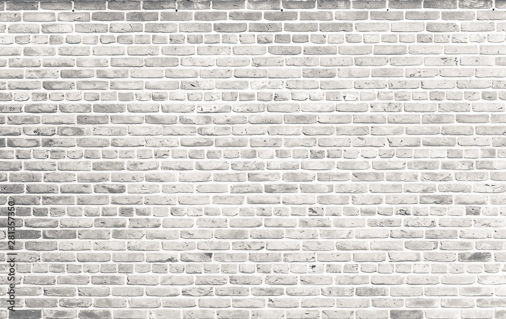 White brick wall. Simple grungy white brick wall with light gray shades pattern surface texture background in wide format.