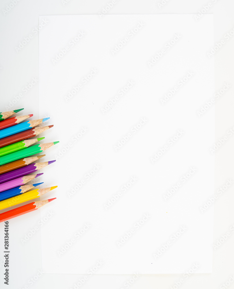 Fototapeta premium Background of colour pencils at the corner of blank drawing paper for kids study and learn art when back school on isolated background.