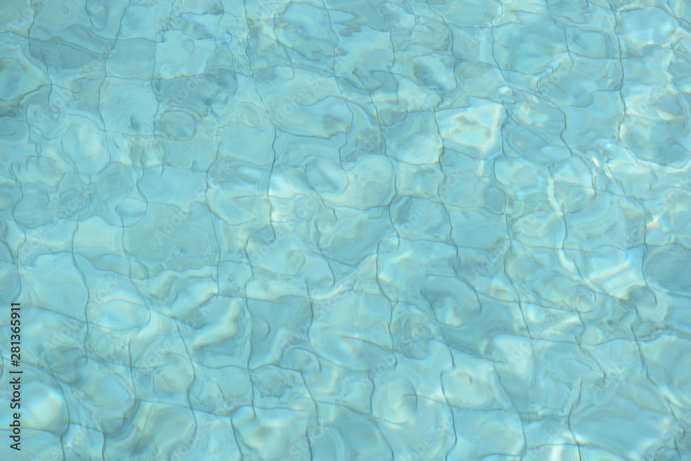 Water surface in a swimming pool. Blurred abstract background Water surface in a swimming pool. Blurred abstract background