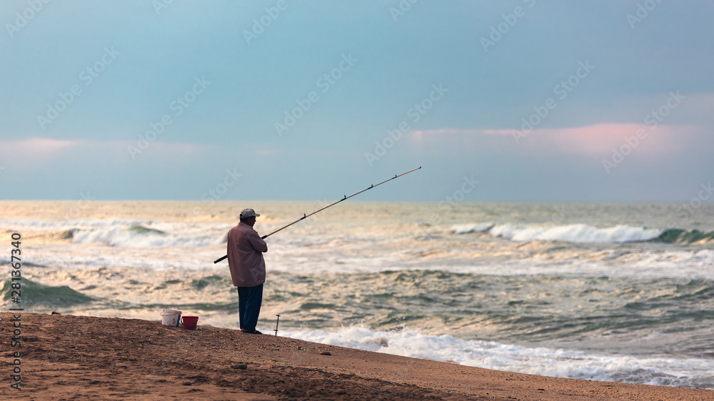 Poor fisherman on the ocean shore