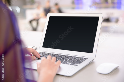 Isolated mockup image of laptop and female hand typing to laptop.