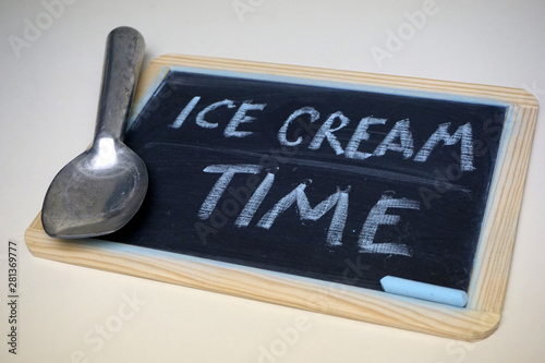 Fototapeta Naklejka Na Ścianę i Meble -  Ice cream time message on chalkboard with scoop