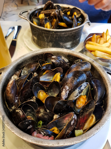Mussels in iron cups national traditional Belgian dish