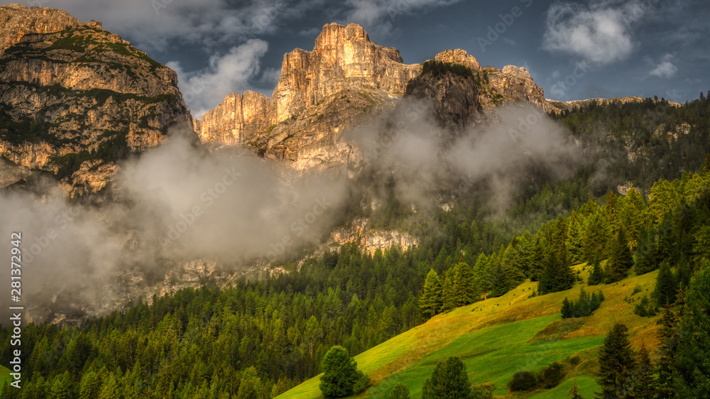 Sunny light over the top of mountain in Alta Badia, Dolomites