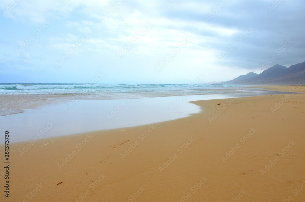 Long and Empty Fine Sand Beach of El Cofete in Fuerteventura on a Cloudy Day 
