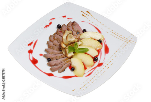 Italian food, raw pork beef with sliced apples on a white isolated background