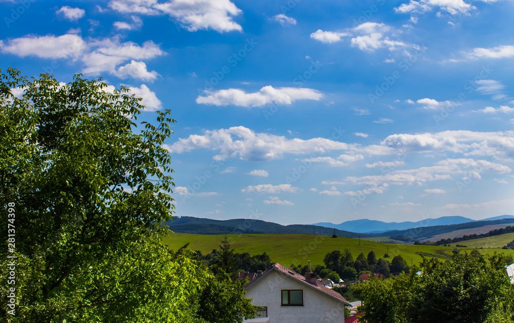 Residential houses on the background of the mountains in the summer, Slovakia