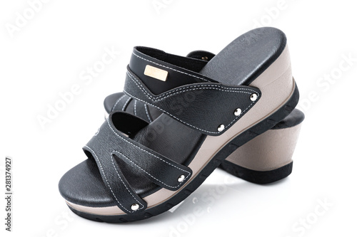 Stylish female leather shoes in black colors isolated on white background. Beauty and fashion concept.