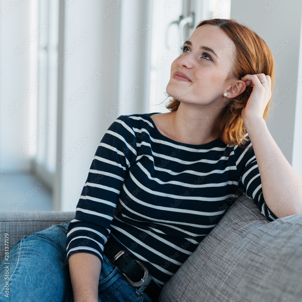 Attractive trendy young woman relaxing at home Attractive trendy young woman relaxing at home
