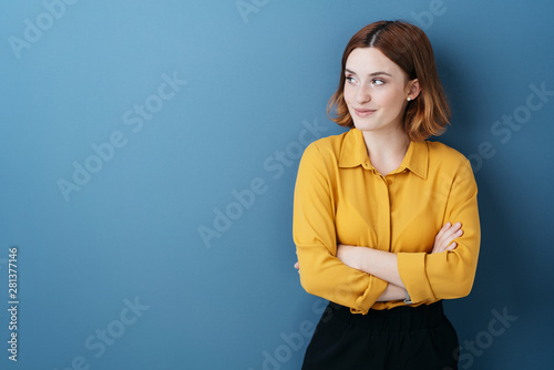 Young woman standing watching to the side