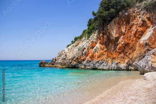 Beautiful beach with rock, stones, sand, and clear turquoise water. Gjipe beach, Albania