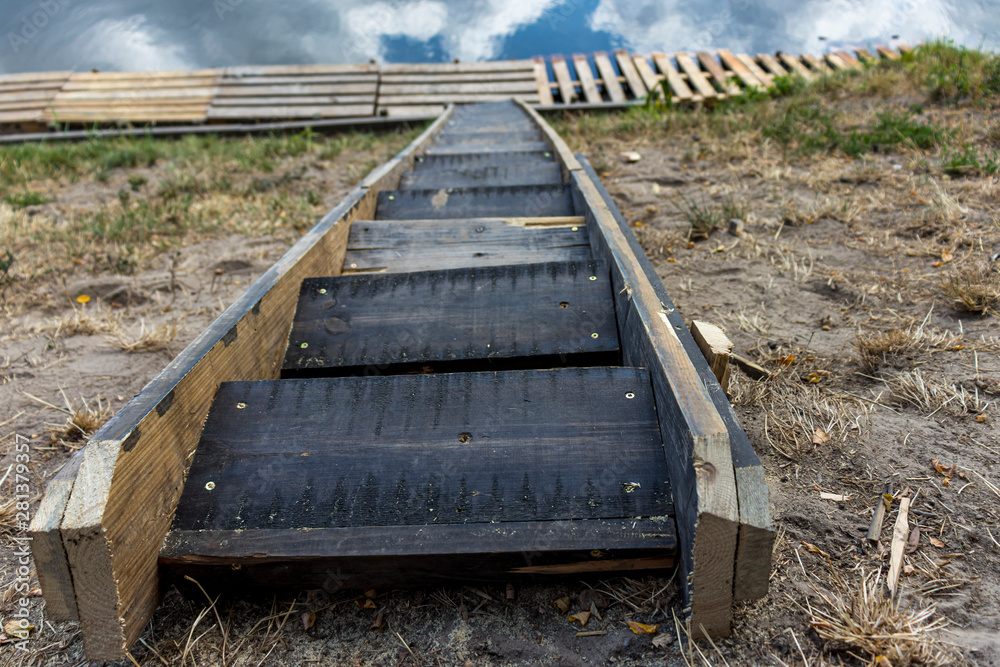 wooden stairs to the pond