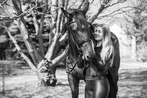 Girl with a horse, countryside place,  woman talking to her horse. Portrait of riding horse with woman at rancho  © T.Den_Team