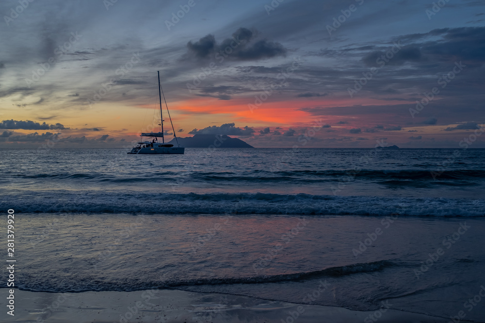 Boat in ocean about sunset at Seychelles, Beau Vallon, Mahe island. Boat in ocean about sunset at Seychelles, Beau Vallon, Mahe island.