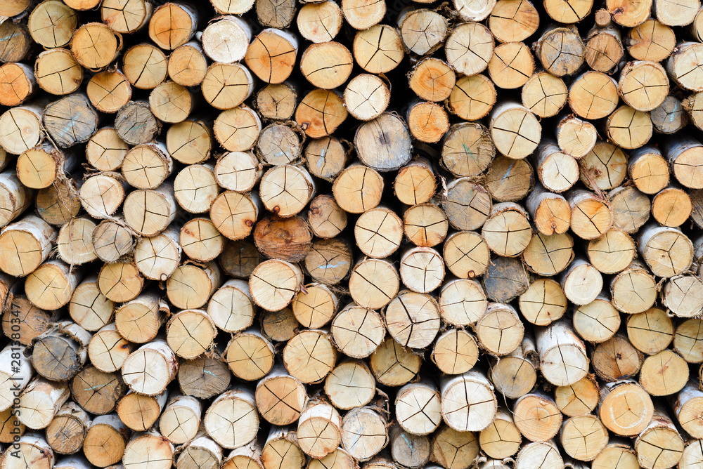 wall firewood - stacked of firewood prepare for the fireplace, barbecue, Background and texture
