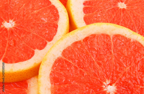 Fresh red grapefruit slices background