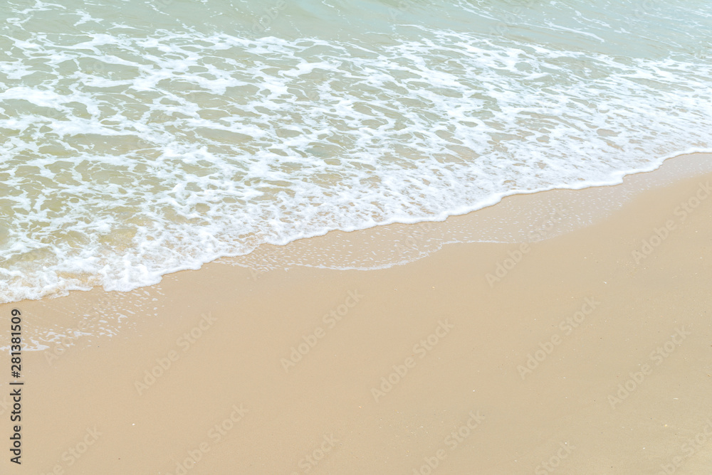 Soft wave at the sea on the sandy beach. Background