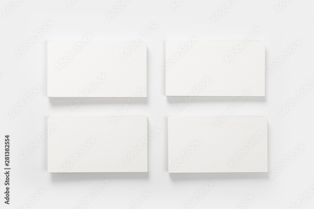 Mockup of business cards stack at white textured background. Design concept. Template for branding identity. Mockup of business cards stack at white textured background. Design concept. Template for branding identity.