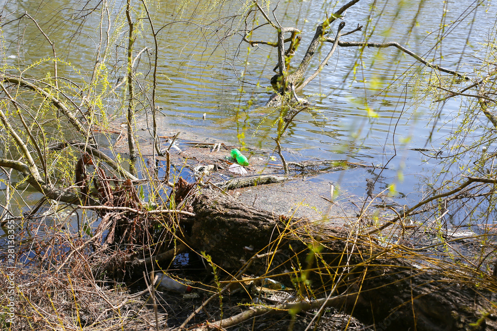 Litter plastic in the nature. Pollution of the environment. Ecological disaster. Green dirty water. Litter plastic in the nature. Pollution of the environment. Ecological disaster. Green dirty water.
