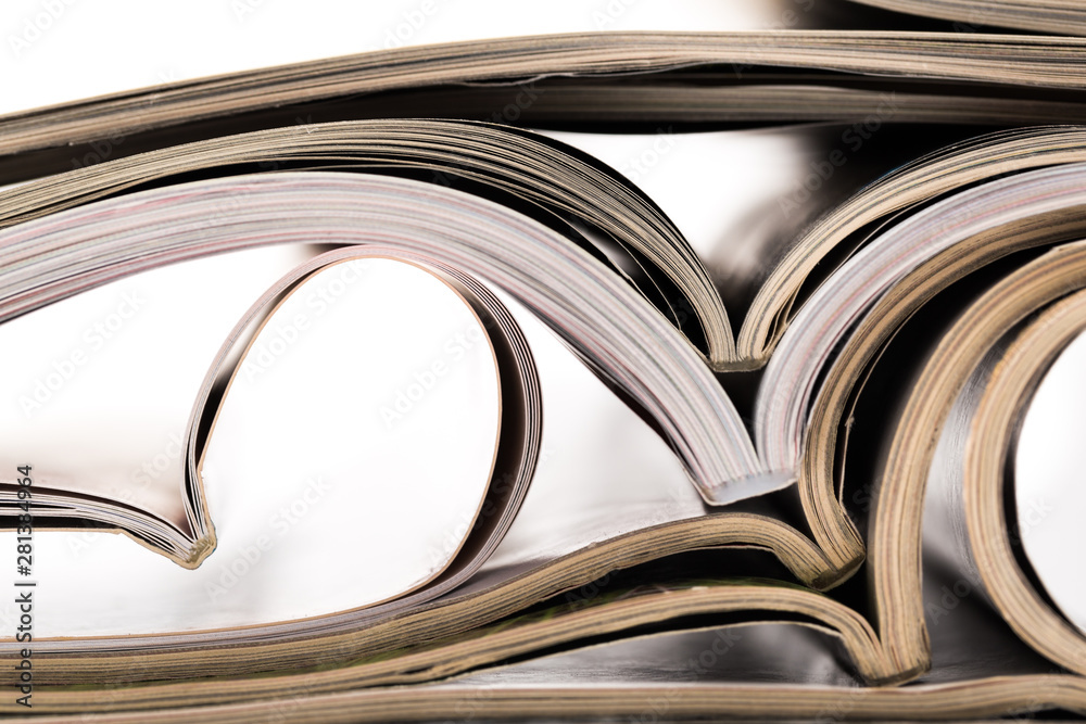 selective focus of the stacking magazine place on white background