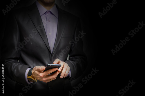 Young cheerful brunete lawyer is standing on the pure light black background