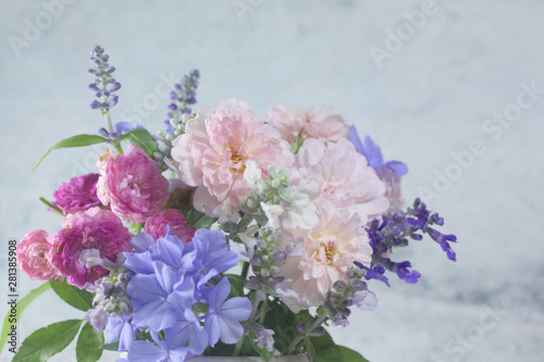 Teddy bear doll with flower bouquet