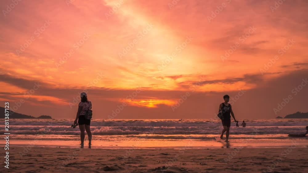 Sunset lovers, bright orange sky, on the beach Famous Phuket Patong Thailand Sunset lovers, bright orange sky, on the beach Famous Phuket Patong Thailand
