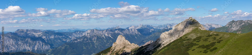 Panoramic view from mountain Wildfeld in the Ennstaler Alps with surrounding summits Stadelstein and Schwarzenstein in summer. Panoramic view from mountain Wildfeld in the Ennstaler Alps with surrounding summits Stadelstein and Schwarzenstein in summer.