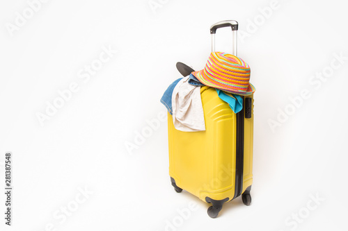 yellow suitcase with clothes of ttourist on a white background. concept quick fees late on the plane