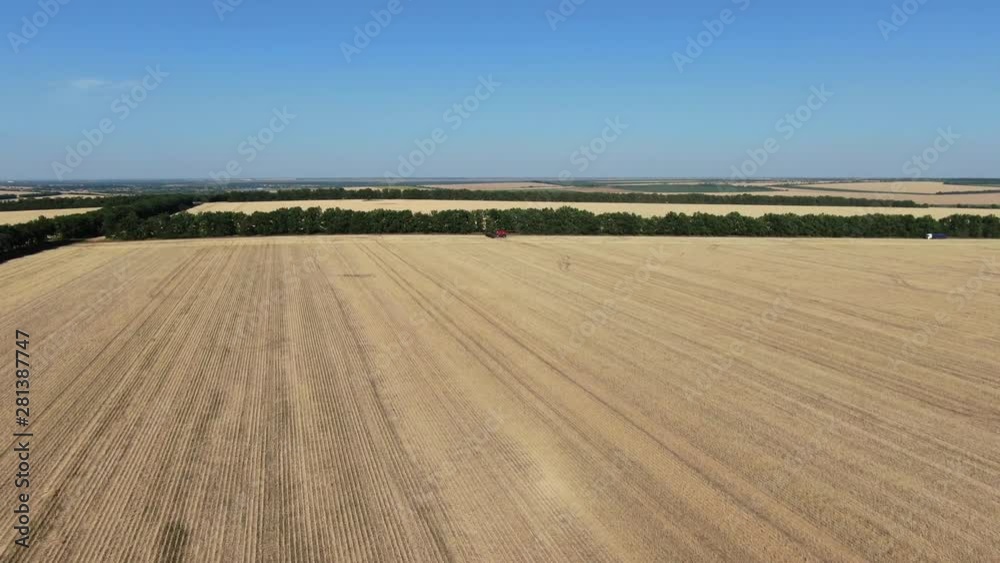 Many big colza fields from high angle, combine harvester is driving, 4k Many big colza fields from high angle, combine harvester is driving, 4k