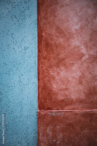 Abstract background - part of a wall: blue and terracotta colored