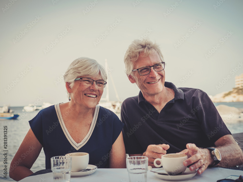 Retired couple enjoying coffee on a resort