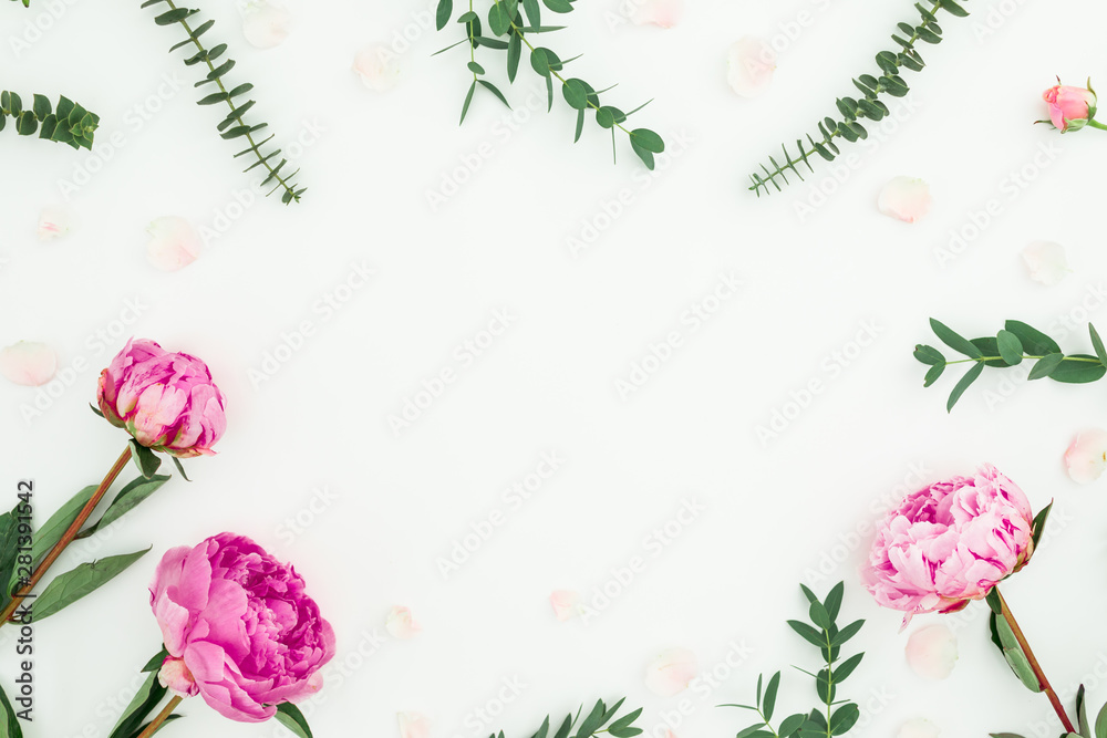 Floral frame with pink peonies, roses and eucalyptus on white background. Flat lay, top view