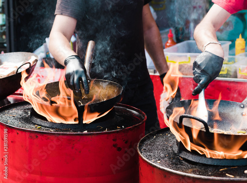 Cooking food in pans at a street festival