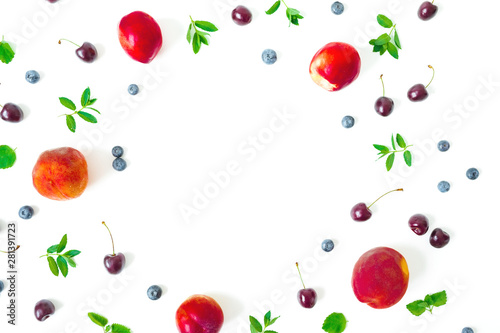 Fototapeta Naklejka Na Ścianę i Meble -  Peaches with cherry and blueberries on white background. Summer food frame. Top view. Flat lay