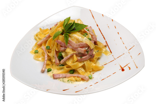 Mixed pasta and vegetables with meat and herbs on a plate