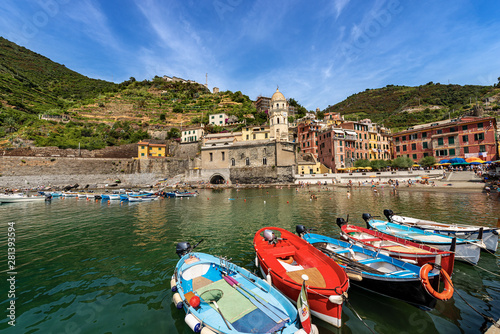Quadro su tela Ancient village of Vernazza with the boats in the harbor