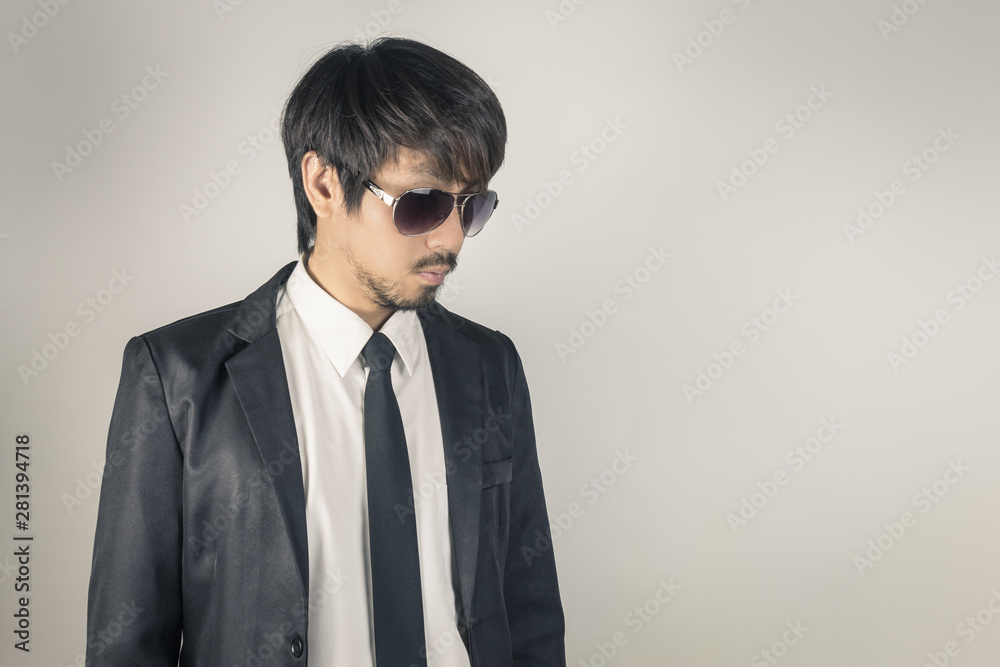 Portrait Businessman in Black Suit and Black Eyeglasses Left Frame in Vintage Tone Portrait Businessman in Black Suit and Black Eyeglasses Left Frame in Vintage Tone