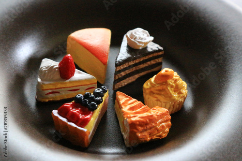 Dish with various cake imitations photo