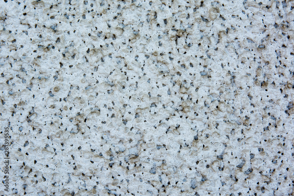 Background of small white and black rocks. Background and texture of small white and black rocks Background of small white and black rocks. Background and texture of small white and black rocks