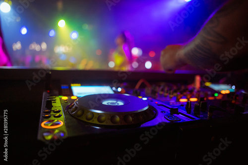 DJ playing music on light background © Семен Саливанчук